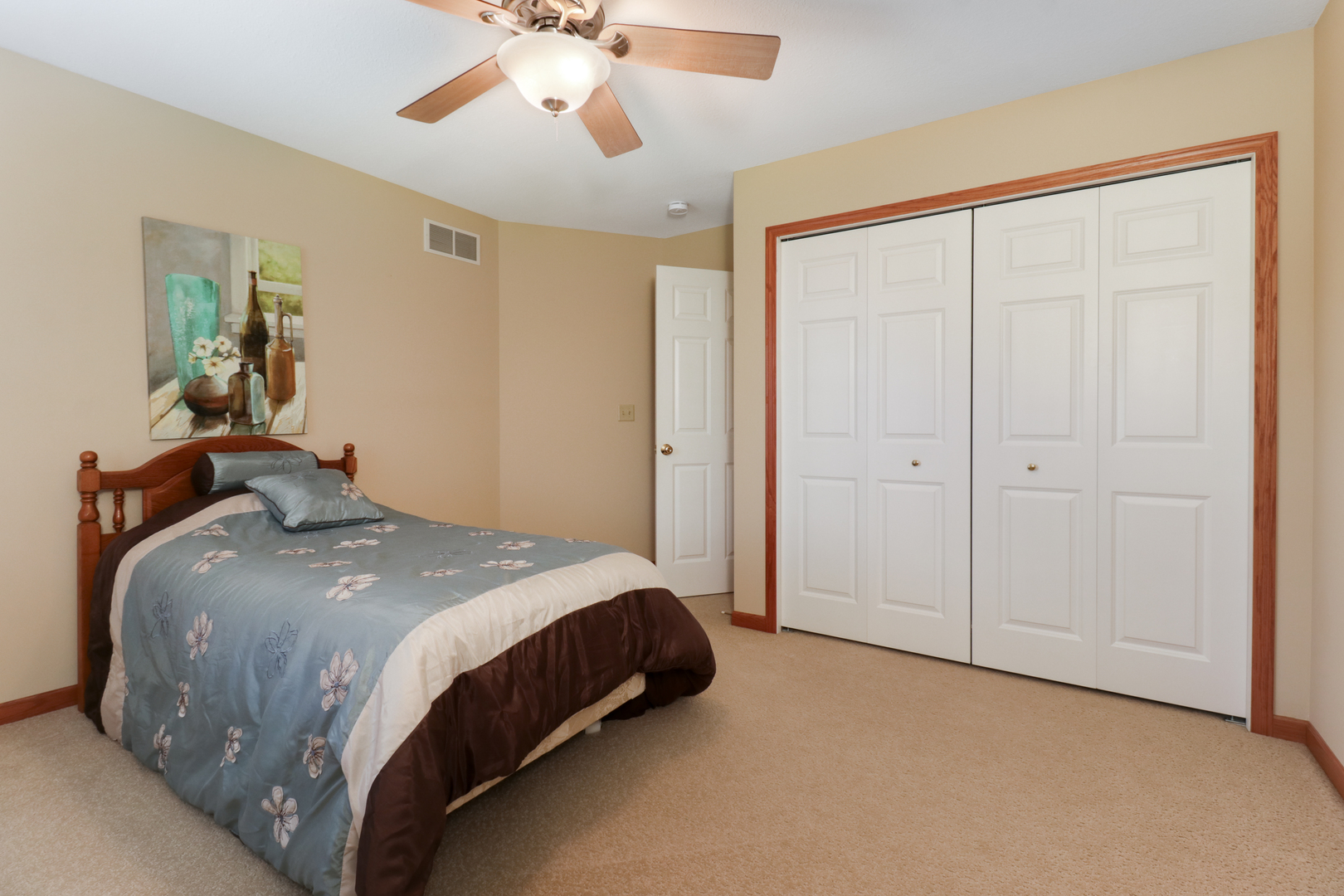 2374 Heather Ridge Drive Normal, IL 61761 - Photo 21 of 31 a bedroom with a bed and a chandelier