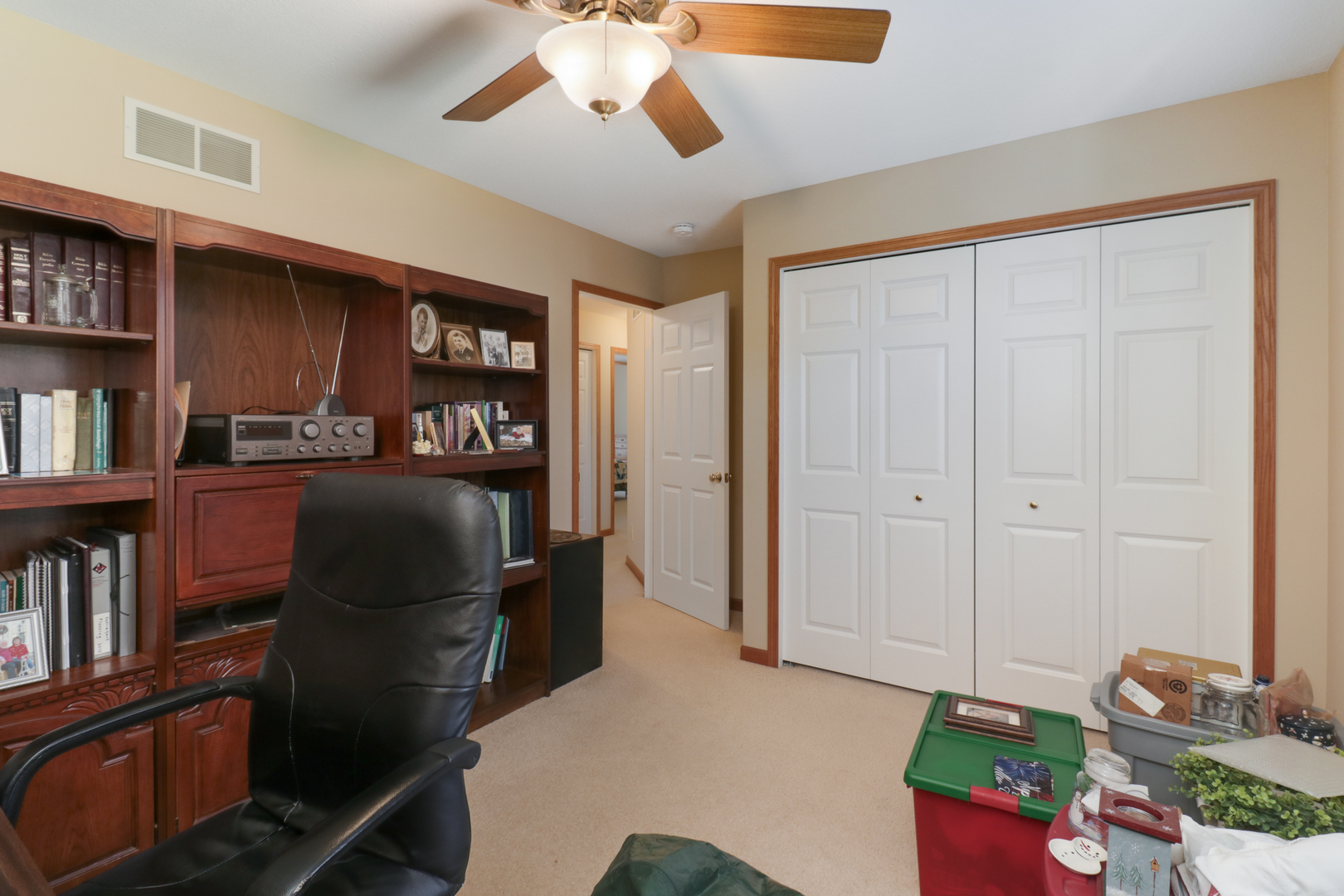 2374 Heather Ridge Drive Normal, IL 61761 - Photo 24 of 31 a bedroom with furniture and a book shelf