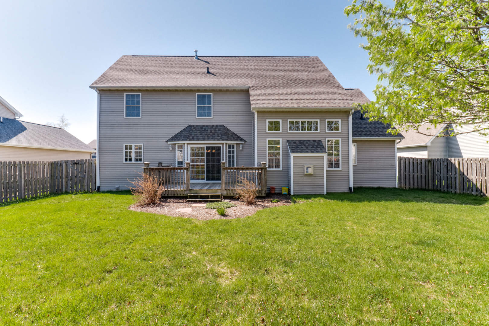 2374 Heather Ridge Drive Normal, IL 61761 - Photo 30 of 31 a front view of a house with a yard garage and table