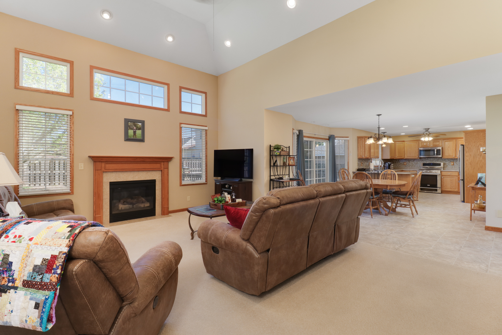 2374 Heather Ridge Drive Normal, IL 61761 - Photo 4 of 31 a living room with furniture and a fireplace