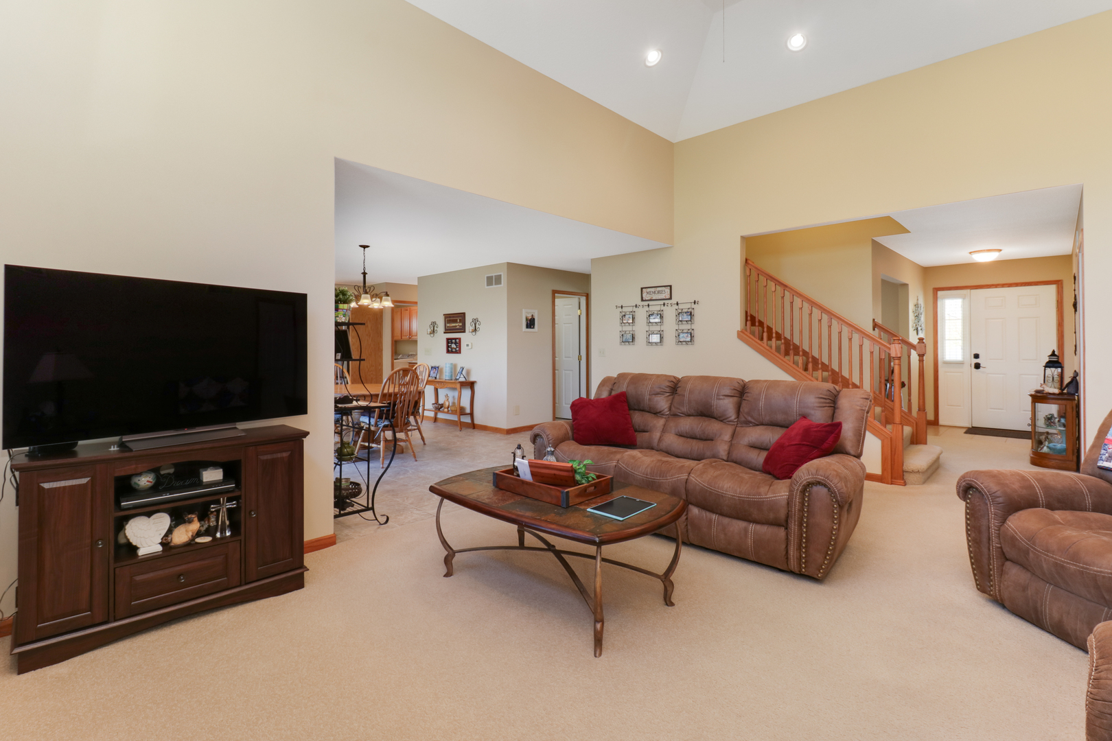 2374 Heather Ridge Drive Normal, IL 61761 - Photo 6 of 31 a living room with furniture and a flat screen tv