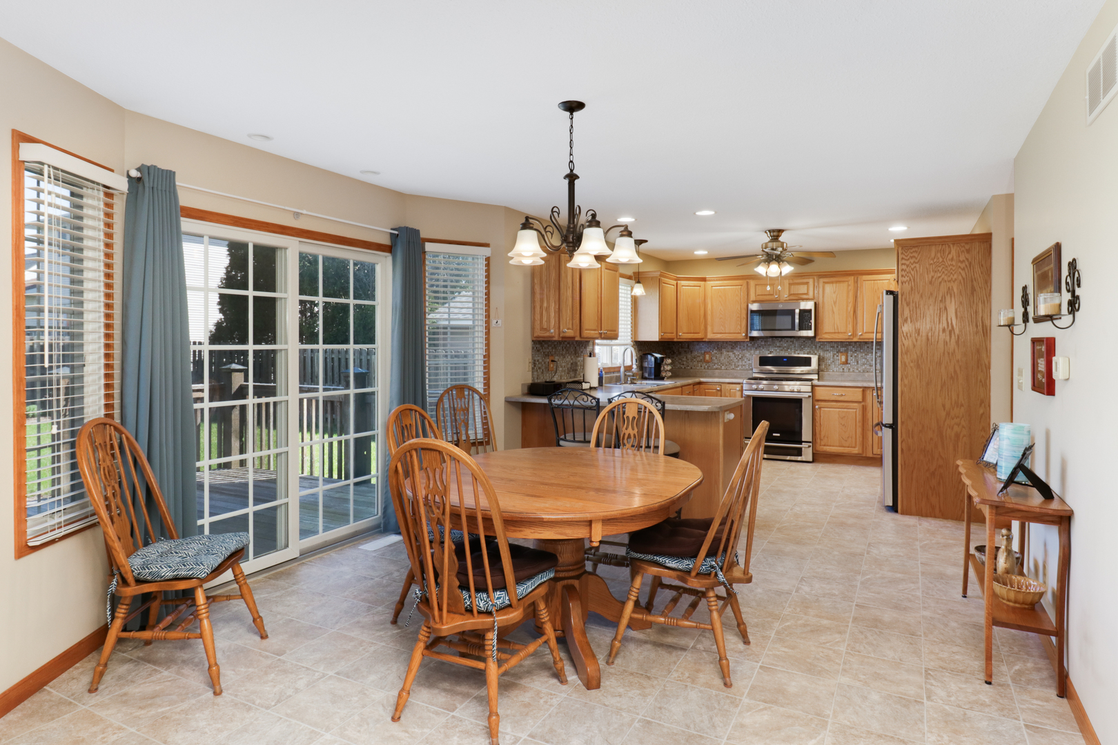2374 Heather Ridge Drive Normal, IL 61761 - Photo 7 of 31 a dining room with furniture a chandelier and window