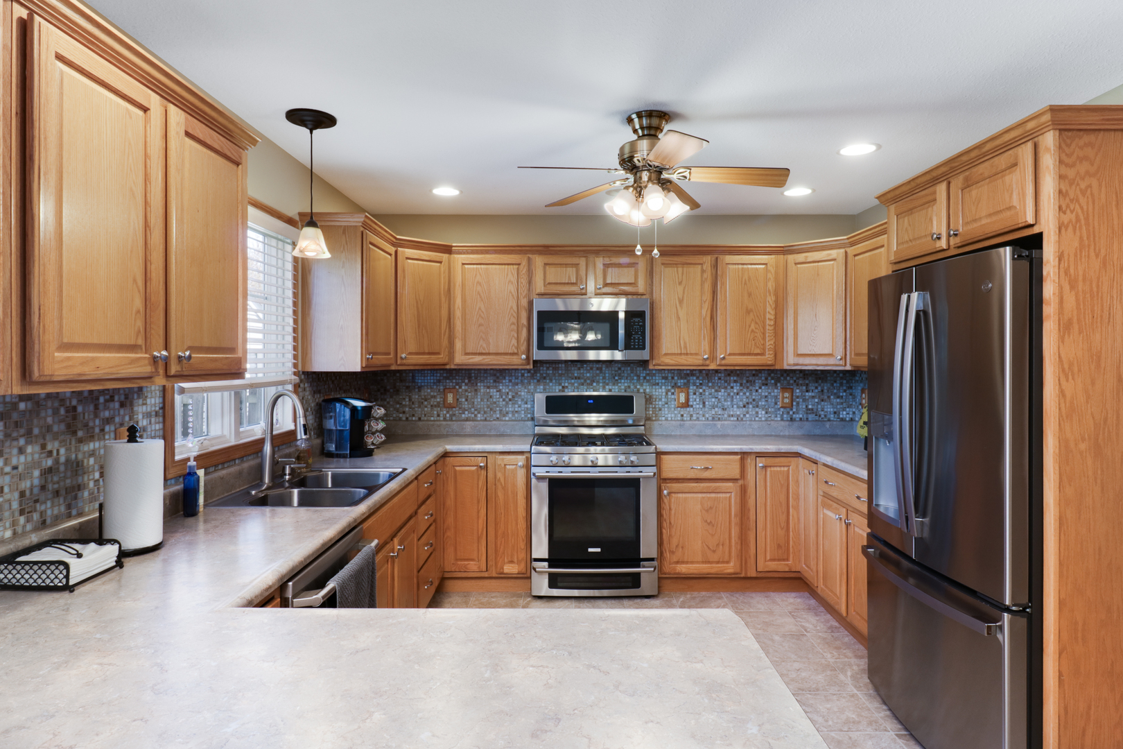 2374 Heather Ridge Drive Normal, IL 61761 - Photo 9 of 31 a kitchen with stainless steel appliances granite countertop a refrigerator a stove top oven a sink and dishwasher