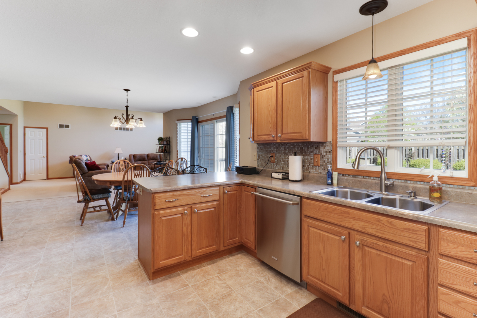 2374 Heather Ridge Drive Normal, IL 61761 - Photo 10 of 31 a kitchen that has a lot of cabinets in it and appliances