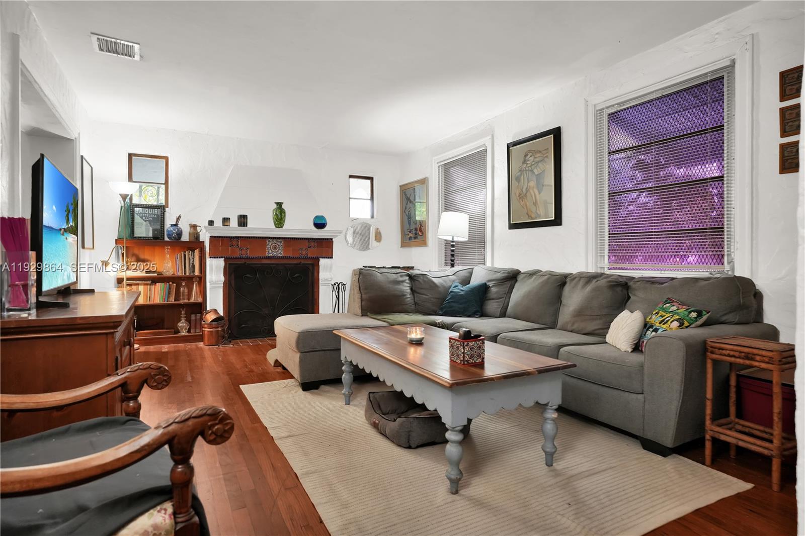 512 Southwest 21st Avenue Miami, FL 33135 - Photo 18 of 33 a living room with furniture and a fireplace