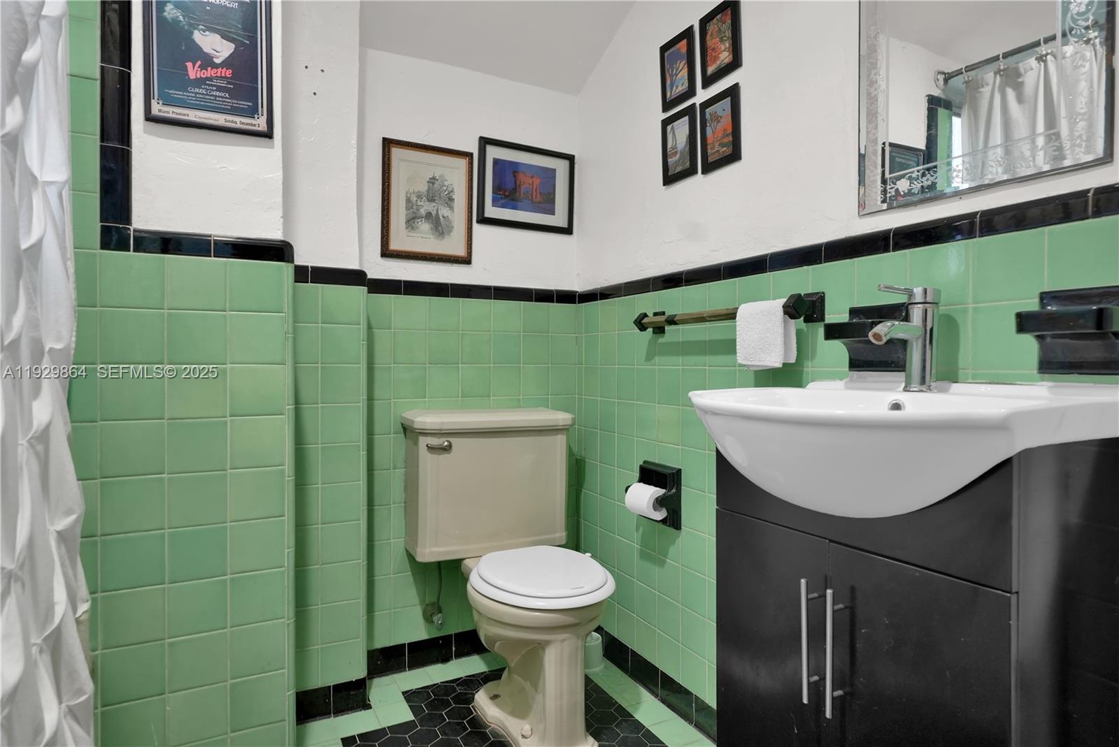 512 Southwest 21st Avenue Miami, FL 33135 - Photo 26 of 33 a bathroom with a toilet sink and mirror