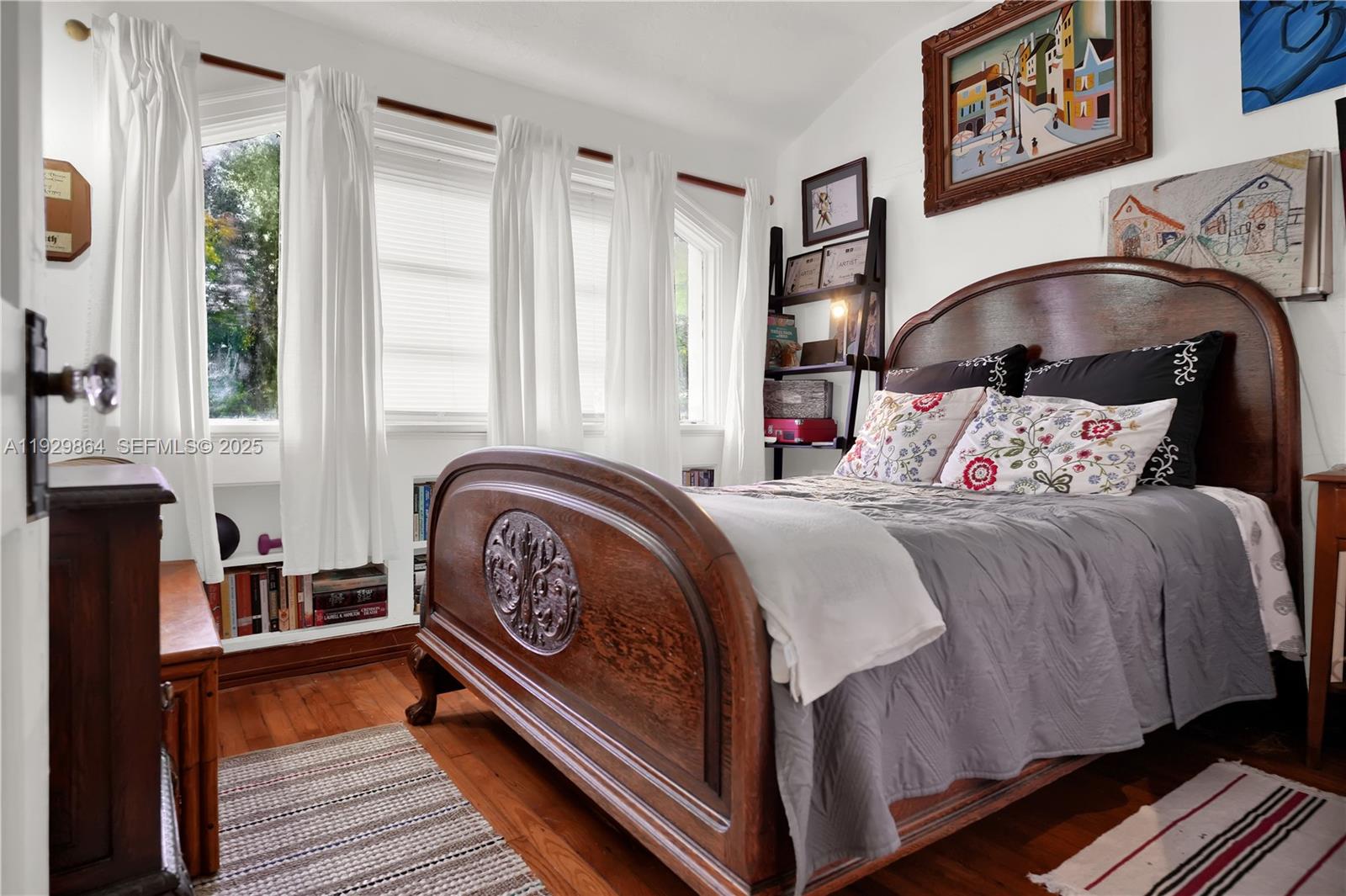 512 Southwest 21st Avenue Miami, FL 33135 - Photo 27 of 33 a bedroom with a bed and wooden floor