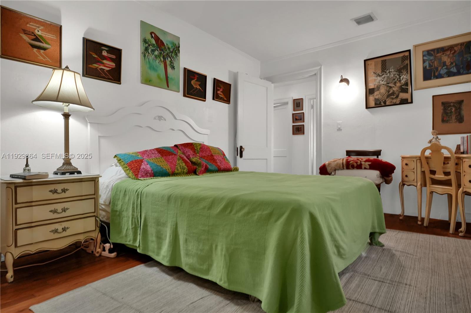 512 Southwest 21st Avenue Miami, FL 33135 - Photo 29 of 33 a bedroom with a bed and furniture