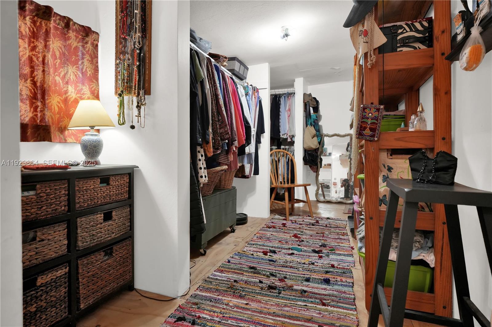 512 Southwest 21st Avenue Miami, FL 33135 - Photo 31 of 33 a view of walk in closet with clothes and shoes