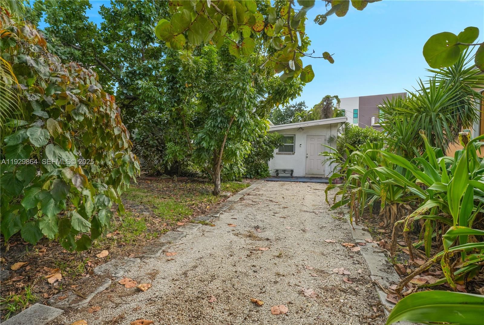 512 Southwest 21st Avenue Miami, FL 33135 - Photo 33 of 33 a backyard of a house with lots of green space
