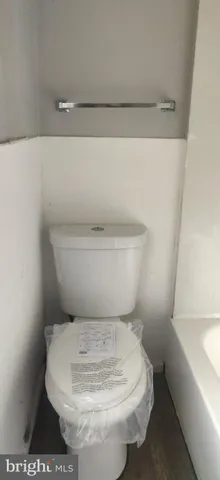 a bathroom with a toilet and a sink