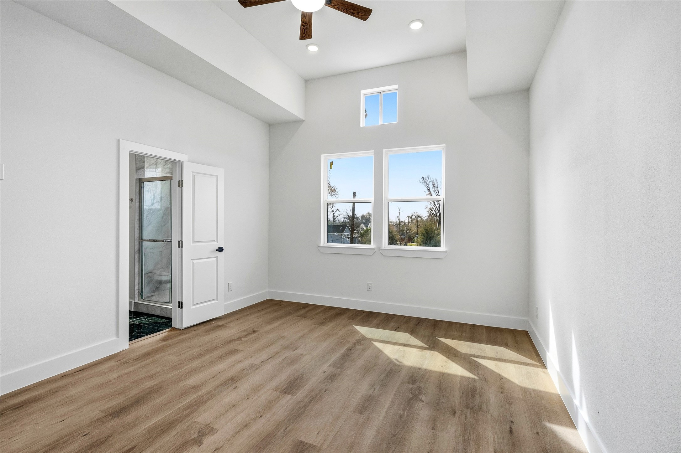 4209 Allston Street Houston, TX 77018 - Photo 22 of 31 an empty room with a window and wooden floor