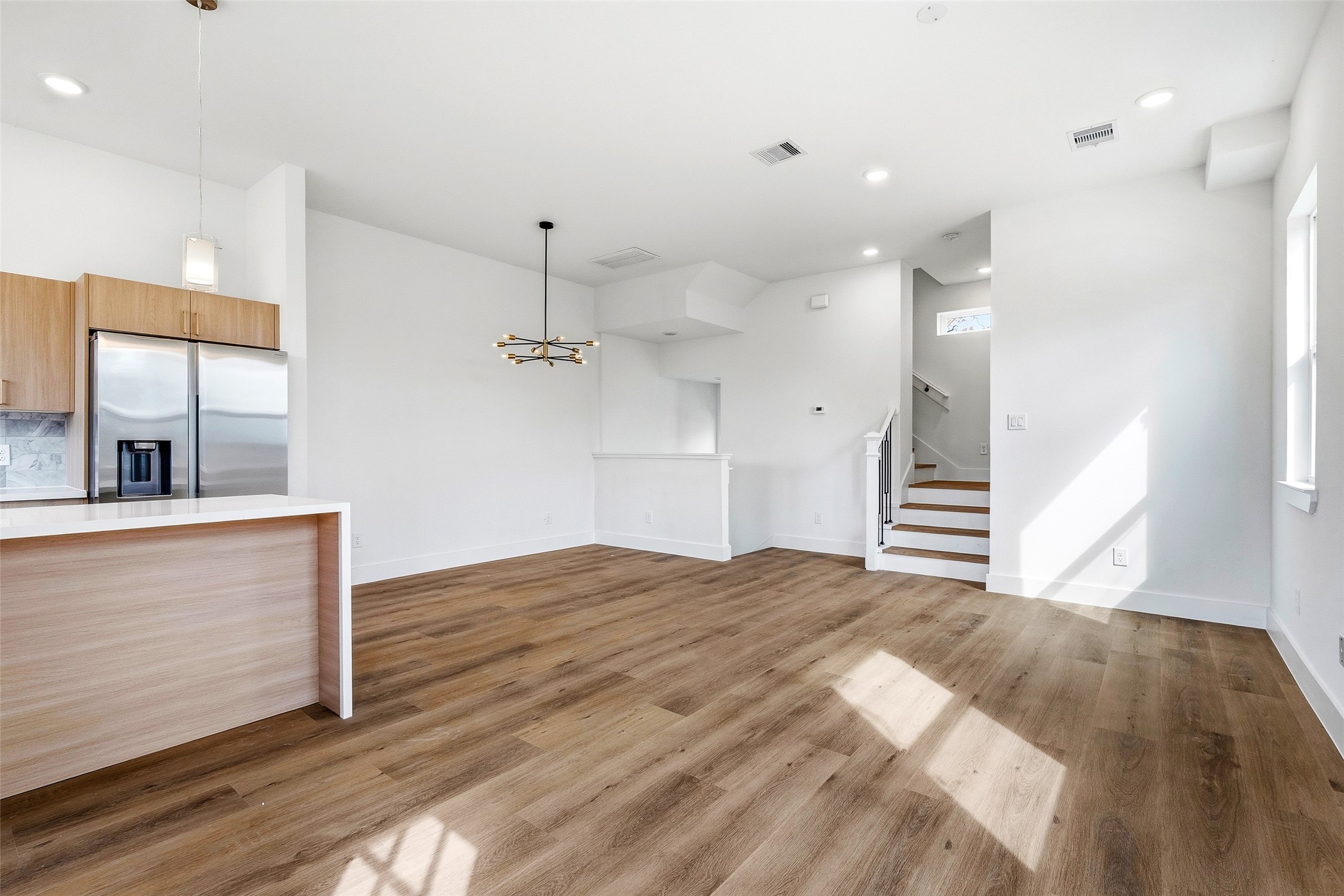 4209 Allston Street Houston, TX 77018 - Photo 10 of 31 a view of empty room with wooden floor and windows