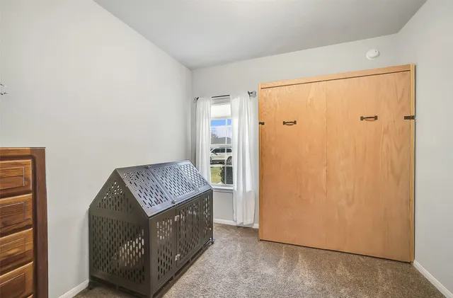 a living room with a couch and a window