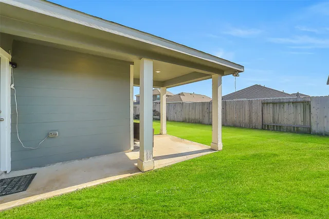 a view of a backyard with a slide