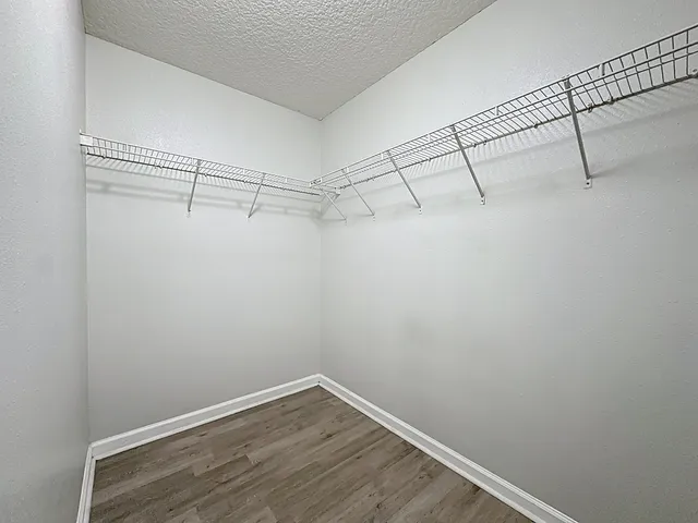 a view of a room with racks on the wall