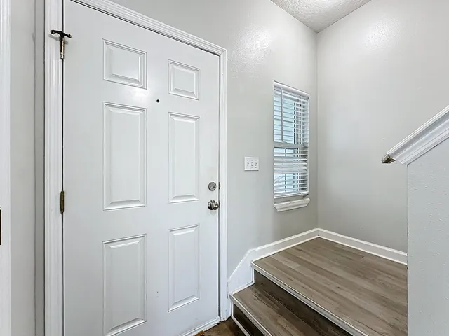 a room that has a bed and a window