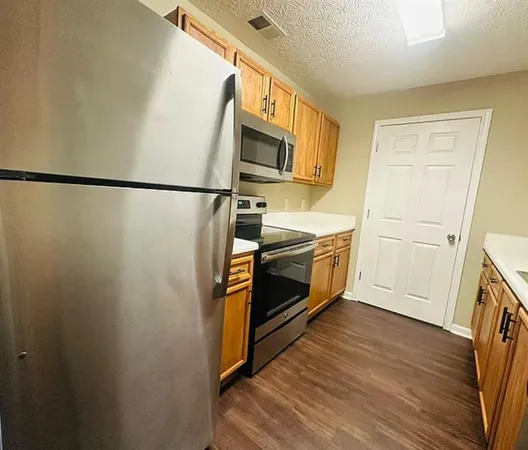 a bathroom with a sink a mirror and a shower