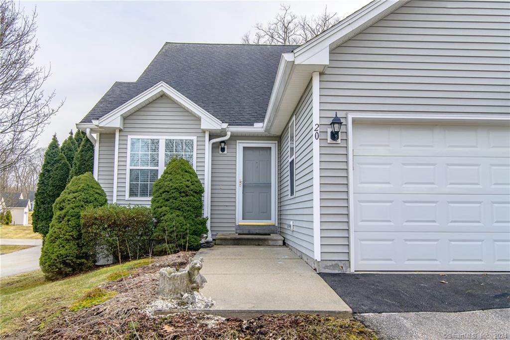 50 Richmond Road, Unit 20 Putnam, CT 06260 - Photo 1 of 1 a view of a house with a yard