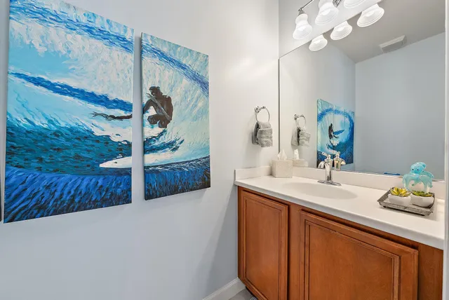 a bathroom with a sink a mirror and a shower