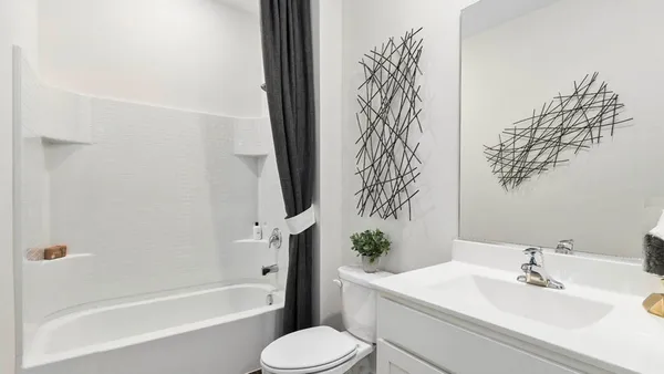 a bathroom with a sink toilet and bathtub