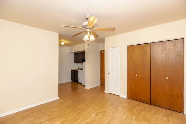 a view of a kitchen with a sink and cabinets