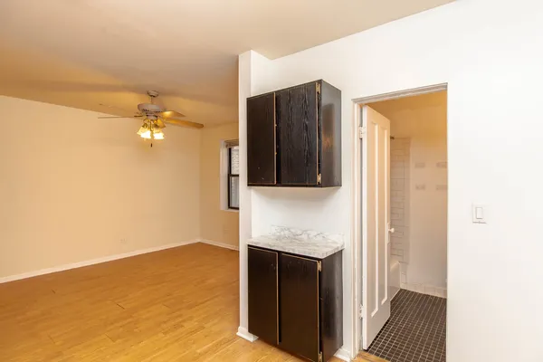 a kitchen with a sink and a refrigerator