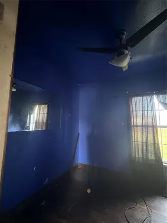 an empty room with a empty space and a window