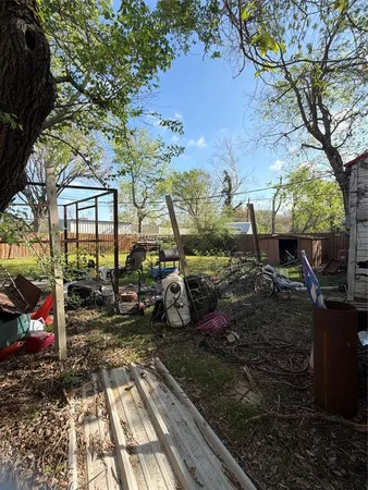 a view of a backyard with sitting area