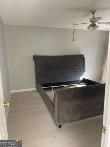 a view of a hallway with wooden shelves