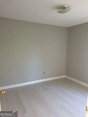 a bathroom with a toilet a sink and shower