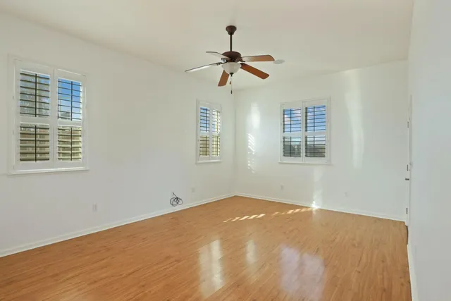 a bathroom with a sink mirror and a bath tub