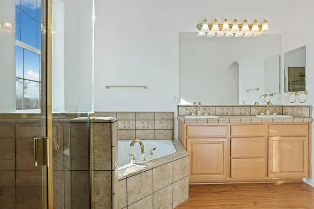 a bathroom with a bathtub and a shower