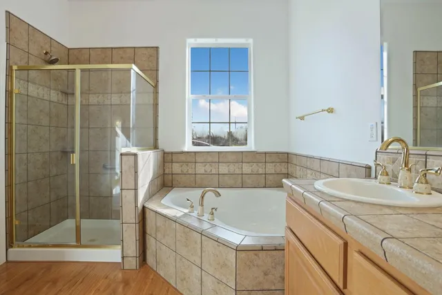 a bedroom with a bed and a lamp on table