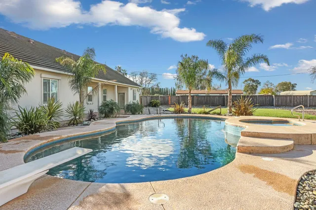 a view of swimming pool with seating space