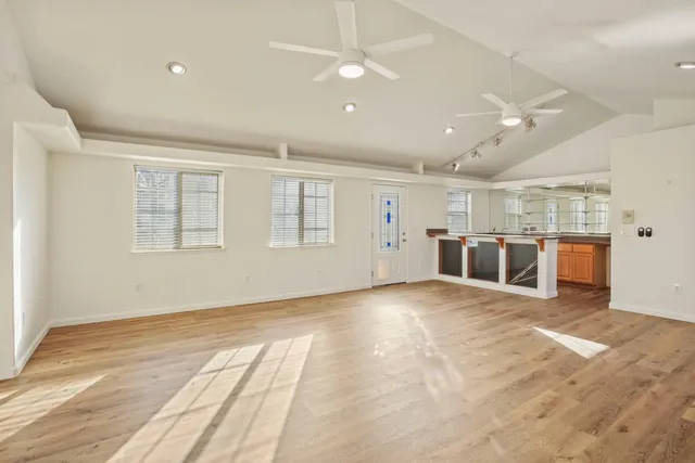 a kitchen with center island table and chairs in it