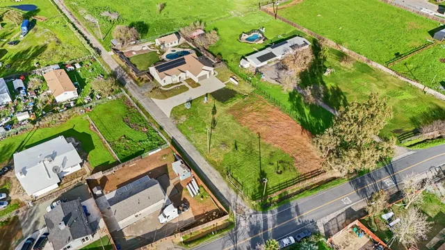 an aerial view of a houses with outdoor space