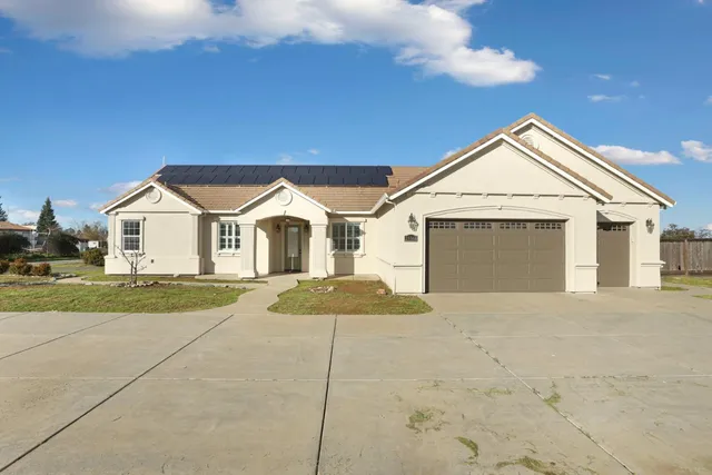 a view of a hallway with a door and windows