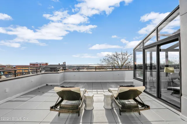 a view of a terrace with furniture and stove