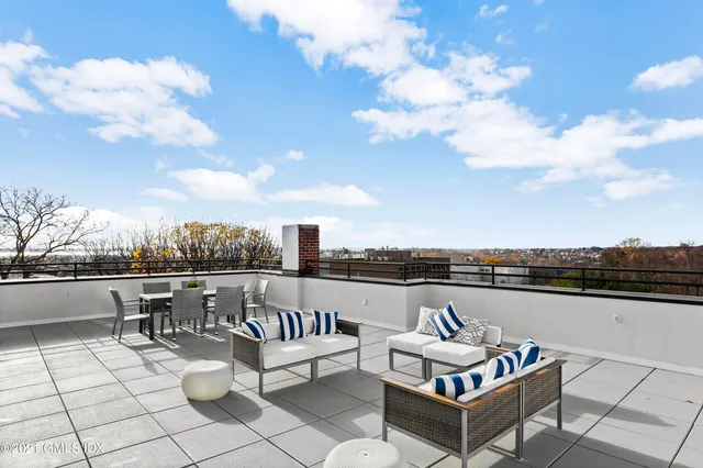 a view of roof deck with seating space