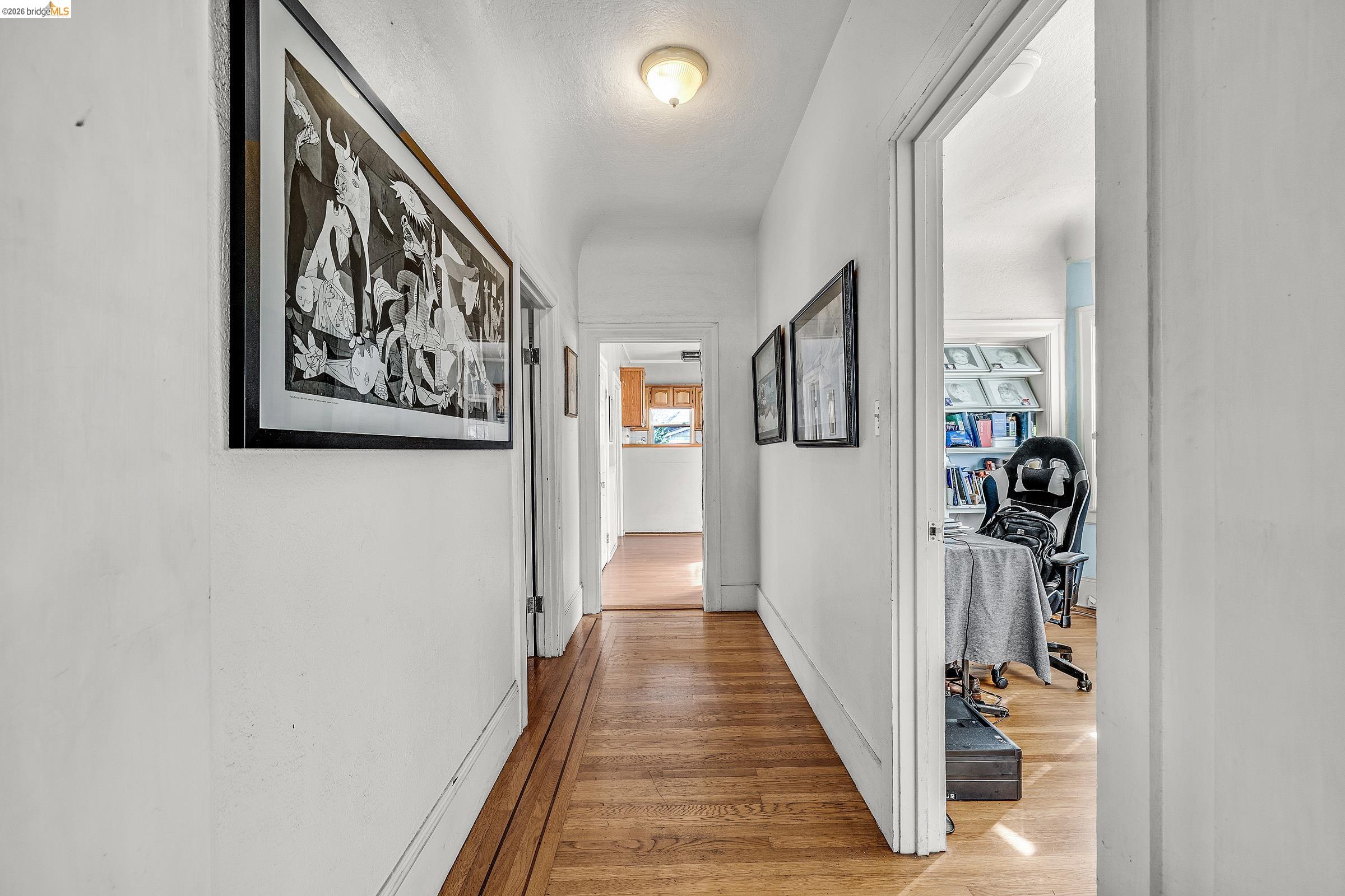 976 Park Street Alameda, CA 94501 - Photo 5 of 36 a view of a hallway with wooden floor and closet