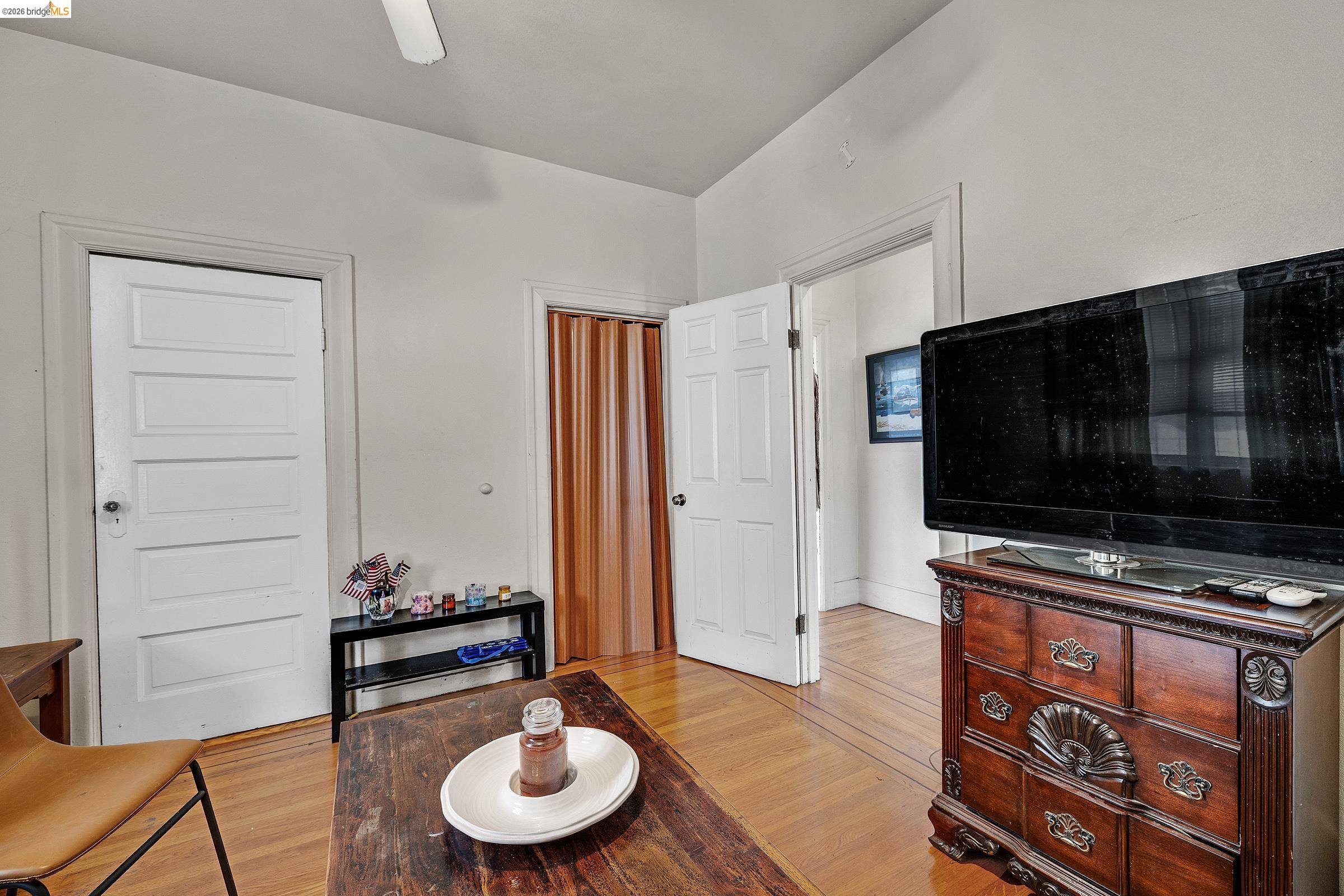 976 Park Street Alameda, CA 94501 - Photo 8 of 36 a living room with furniture and a flat screen tv
