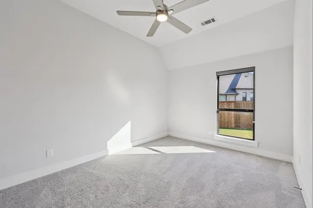 an empty room with a empty space and windows