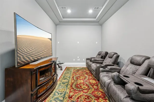 a bedroom with furniture and a fireplace