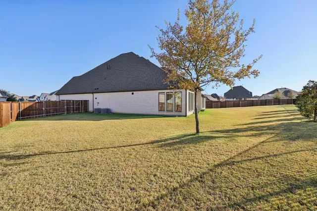 a house with a trees in the background