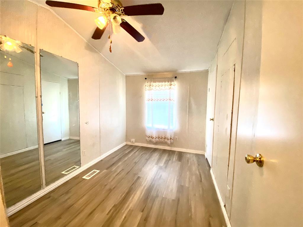 100 South Beltline Road, Unit 79 Dallas, TX 75253 - Photo 12 of 15 a view of empty room with wooden floor