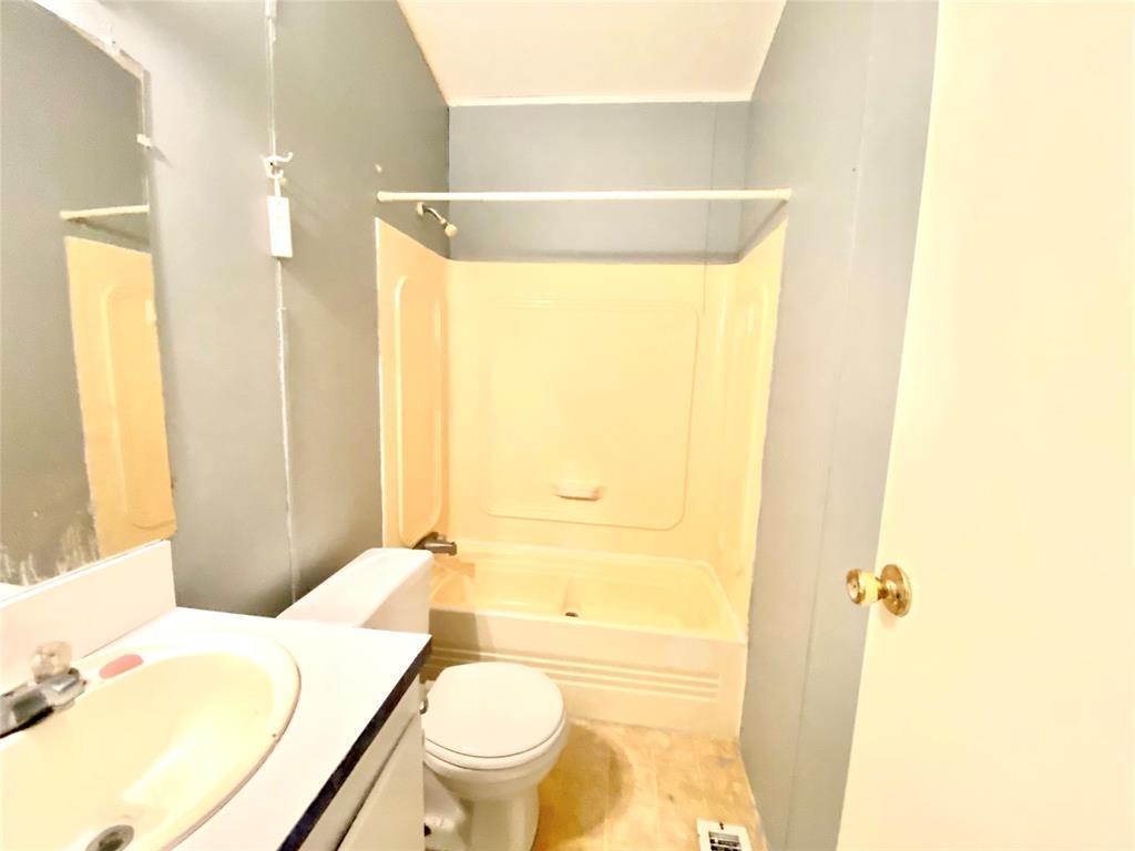 100 South Beltline Road, Unit 79 Dallas, TX 75253 - Photo 14 of 15 a bathroom with a granite countertop sink toilet and shower