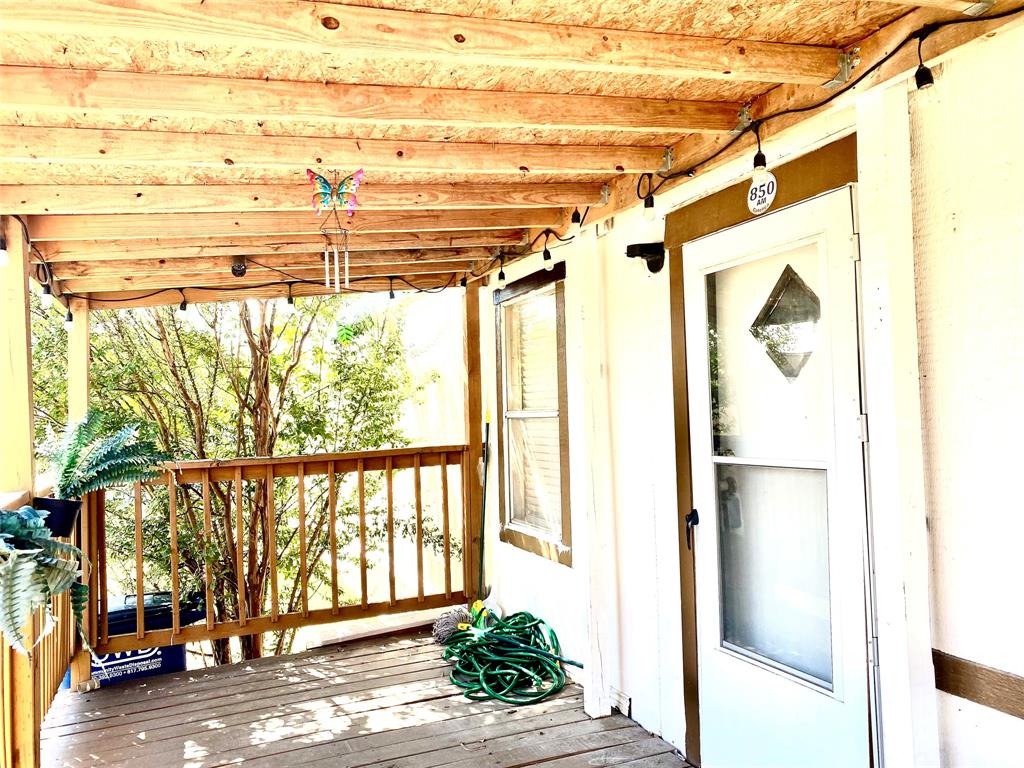 100 South Beltline Road, Unit 79 Dallas, TX 75253 - Photo 3 of 15 a view of a porch with a floor to ceiling window next to a yard