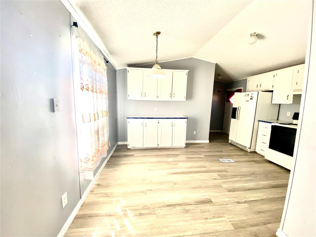 100 South Beltline Road, Unit 79 Dallas, TX 75253 - Photo 6 of 15 a view of a kitchen with a refrigerator and a window