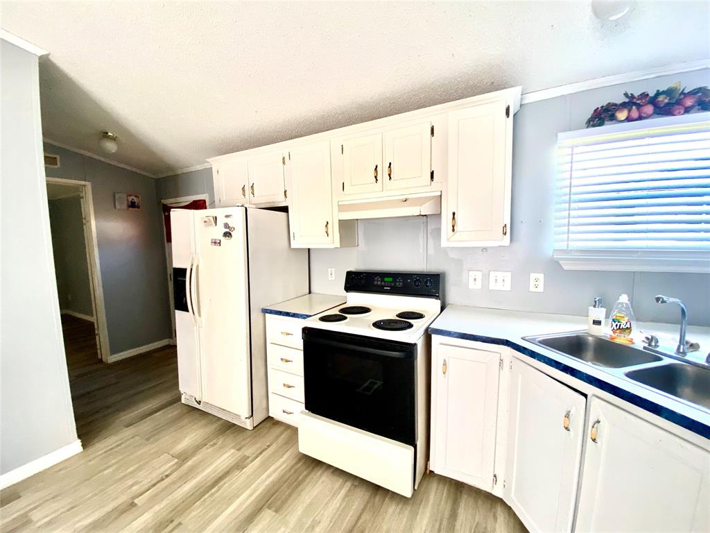 100 South Beltline Road, Unit 79 Dallas, TX 75253 - Photo 7 of 15 a kitchen with a refrigerator sink and cabinets